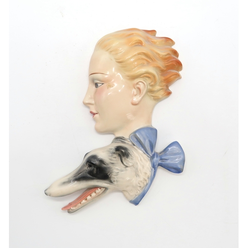 2187 - A GOEBEL WALL MASK BY AGNES RICHARDSONmodelled as a girls head with curly blonde hair, no R24, 21.5c... 