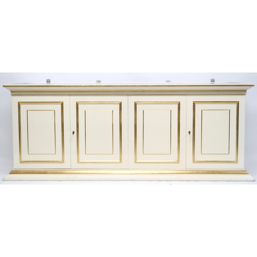 2086 - A CONTEMPORARY GILT WHITE VERSACE MIRROR BACK SIDEBOARD mirror with gilt moulded cornice over rectan... 