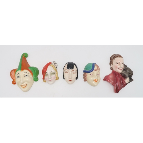 2189 - A COLLECTION OF CZECHOSLOVAKIAN ART DECO WALL MASKSmodelled as female heads with painted decoration,... 