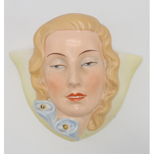 2189 - A COLLECTION OF CZECHOSLOVAKIAN ART DECO WALL MASKSmodelled as female heads with painted decoration,... 