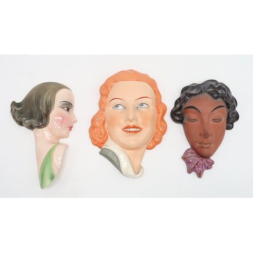 2191 - A COLLECTION OF CZECHOSLOVAKIAN ART DECO WALL MASKSall of girls' heads, including a Royal Dux exampl... 