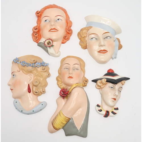 2192 - A COLLECTION OF CZECHOSLOVAKIAN ART DECO WALL MASKSall of girls' heads, including a Royal Dux exampl... 