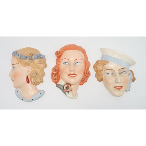 2192 - A COLLECTION OF CZECHOSLOVAKIAN ART DECO WALL MASKSall of girls' heads, including a Royal Dux exampl... 