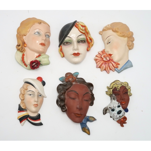 2193 - A COLLECTION OF CZECHOSLOVAKIAN ART DECO WALL MASKSall of girls' heads, including two terracotta exa... 