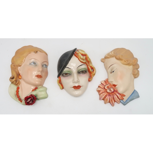 2193 - A COLLECTION OF CZECHOSLOVAKIAN ART DECO WALL MASKSall of girls' heads, including two terracotta exa... 