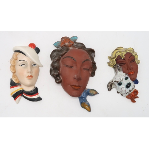 2193 - A COLLECTION OF CZECHOSLOVAKIAN ART DECO WALL MASKSall of girls' heads, including two terracotta exa... 