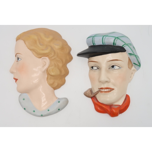 2194 - A COLLECTION OF CZECHOSLOVAKIAN AND OTHER ART DECO WALL MASKSone of a man in a cap smoking a pipe, t... 