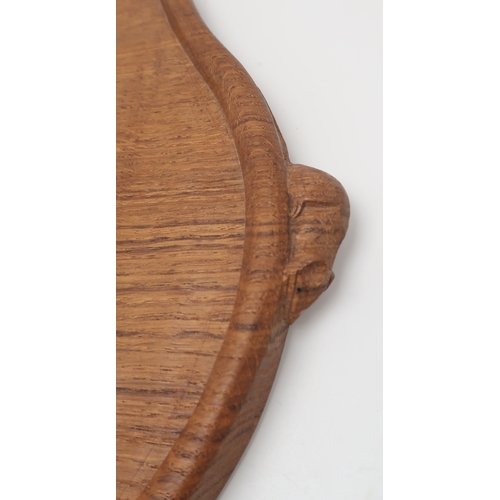 2200 - ROBERT MOUSEMAN THOMPSON (1876-1955)An oak kidney shaped tea tray, with twin carved mouse signature ... 