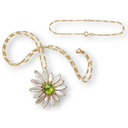 2728 - A MOONSTONE AND PERIDOT FLOWERmounted in 18ct gold to be worn as a pendant or brooch, stamped with t... 