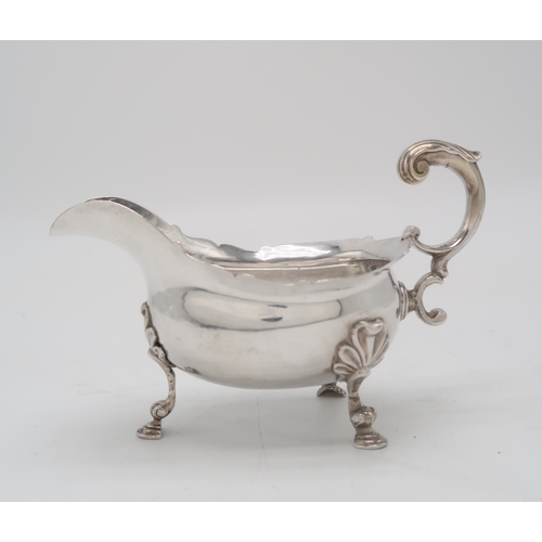 2479 - A HEAVY GAUGE GEORGE II SILVER SAUCE BOATLondon 1755, maker's mark I.?, engraved with a crest and mo... 