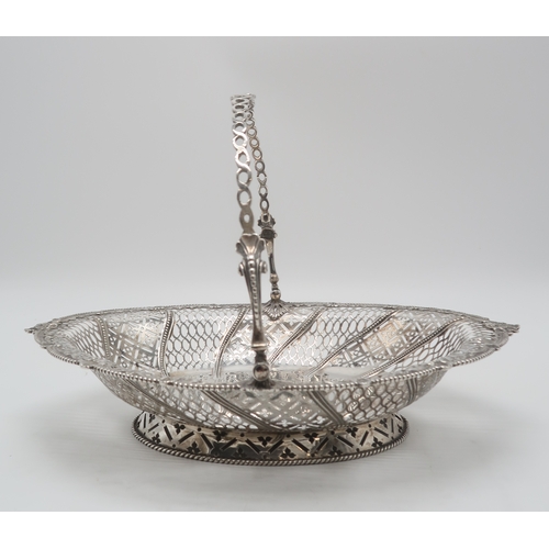 2480 - A GEORGE III SILVER SWING-HANDLED BASKETby Emick Romer, London 1768, of oval form, with a beaded she... 