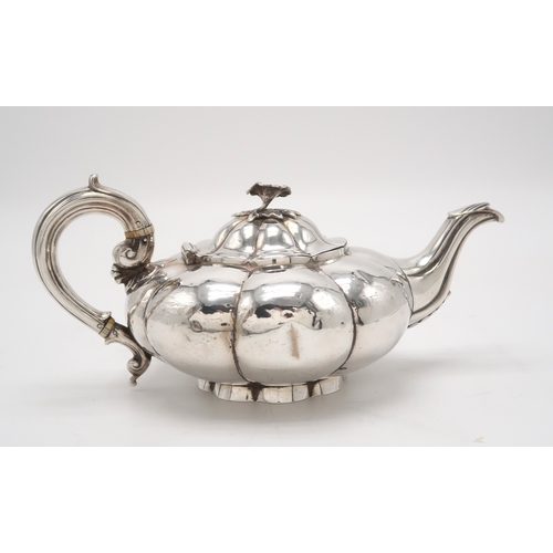 2481 - A WILLIAM IV SILVER TEAPOTby Charles Gordon, London 1833, of compressed melon form, with a floral fi... 