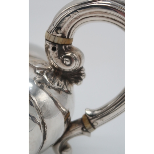 2481 - A WILLIAM IV SILVER TEAPOTby Charles Gordon, London 1833, of compressed melon form, with a floral fi... 