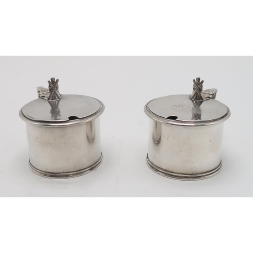 2493 - MILITARY INTEREST;A pair of Victorian silver mustard pots, by Samuel Whitford, London 1870, of circu... 