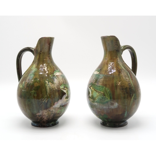 2212 - A PAIR OF FRENCH POTTERY EWERSeach painted with two frogs on naturalistic ground, each signed to the... 