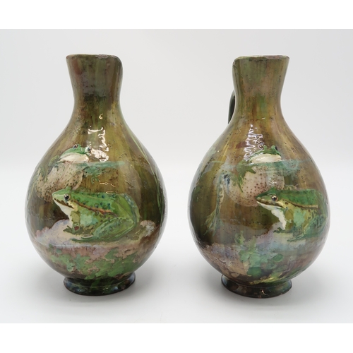 2212 - A PAIR OF FRENCH POTTERY EWERSeach painted with two frogs on naturalistic ground, each signed to the... 