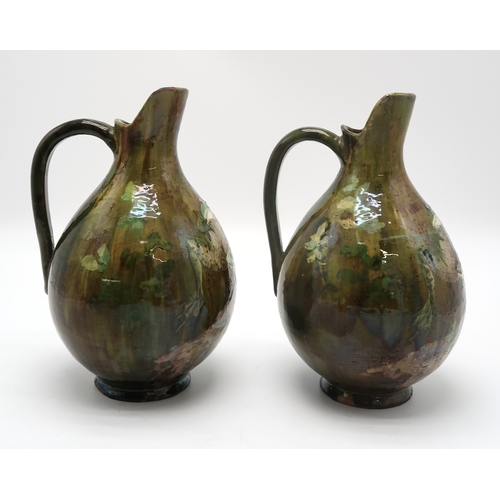 2212 - A PAIR OF FRENCH POTTERY EWERSeach painted with two frogs on naturalistic ground, each signed to the... 