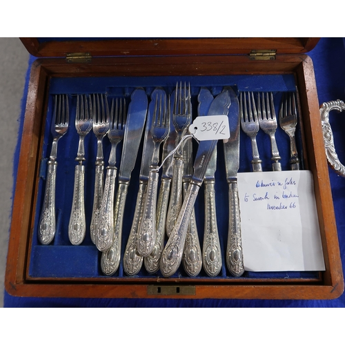 338 - An oak canteen of stainless steel mother of pearl handled fish knives and forks, 17 pairs (one missi... 