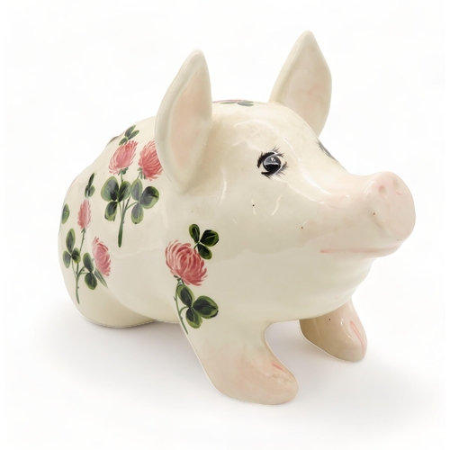 183 - A Griselda Hill pottery pig painted with clover, 12cm high