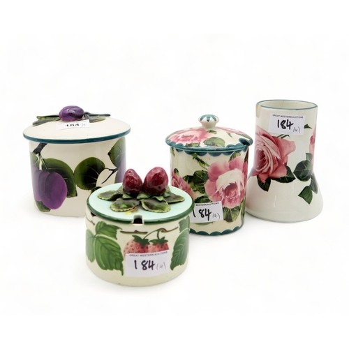 184 - A Griselda Hill plum pot, a Wemyss cabbage rose preserve pot and vase, together with a strawberry po... 