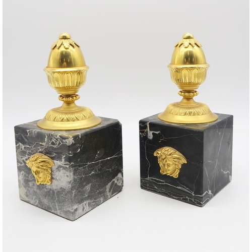 211 - A pair of Versace Lithos marble and gilt metal bookends