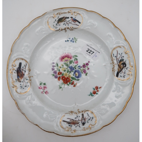 227 - A small collection of 18th century and later ceramics including a Meissen plate painted with flowers... 