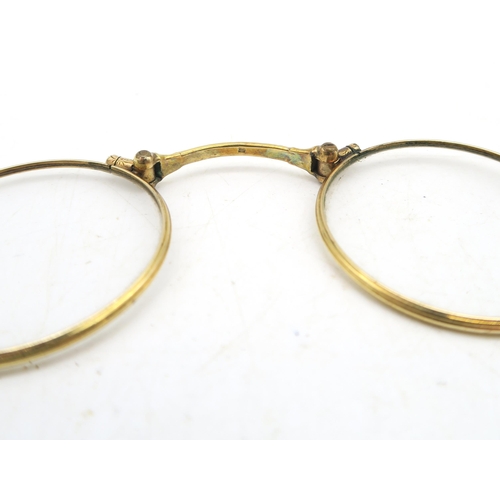 539 - A pair of gilt metal lorgnettes, with sprung release mechanism 