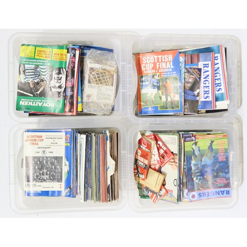 570 - A large collection of 1980s-era Rangers and Celtic F.C. football programmes and related ephemera, in... 