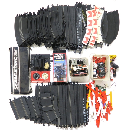 550A - A large quantity of Scalextric track, vehicles and accessories