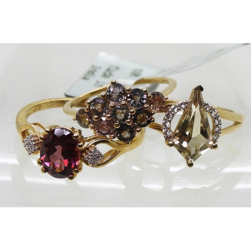 783 - Three 9ct gold rings, a colour change sapphire flower ring, with GemsTV certificate, finger size K a... 