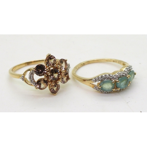 787 - A 9ct white sapphire and smoky quartz flower ring size O, together with a pale blue gem three stone ... 