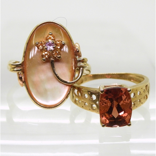 795 - A 9ct gold orange citrine ring with scrolled shoulders, size K, together with a yellow mother of pea... 