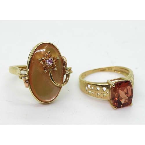 795 - A 9ct gold orange citrine ring with scrolled shoulders, size K, together with a yellow mother of pea... 