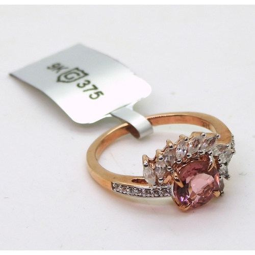 800 - A 9ct gold pink tourmaline and white zircon fan shaped ring, size O, weight 3gms