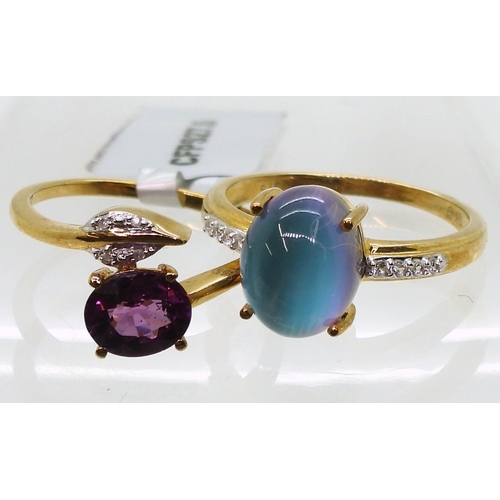 805 - A 9ct gold garnet and diamond leaf ring, size L1/2, together with a 9ct gold ring set with a aurora ... 