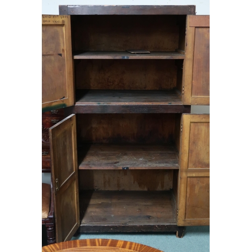 101 - An early 20th century stained pine pantry cupboard with pair of panel doors over another pair of pan... 