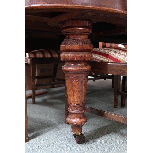 127 - A lot comprising a Victorian oak wind out extending dining table on turned supports terminating in c... 