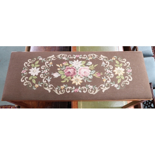 129 - A 20th century floral tapestry upholstered piano stool