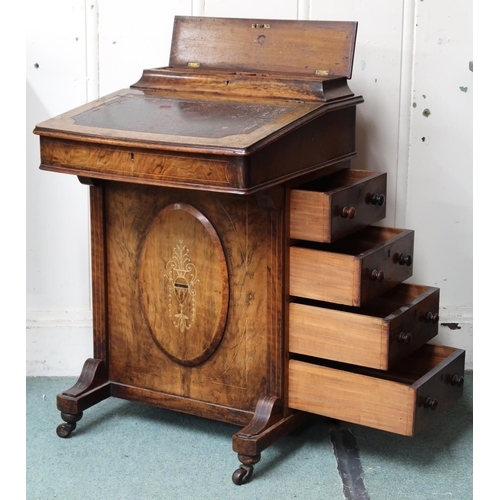 20 - A Victorian walnut veneered Davenport with hinged writing slope top over four drawers to right hand ... 