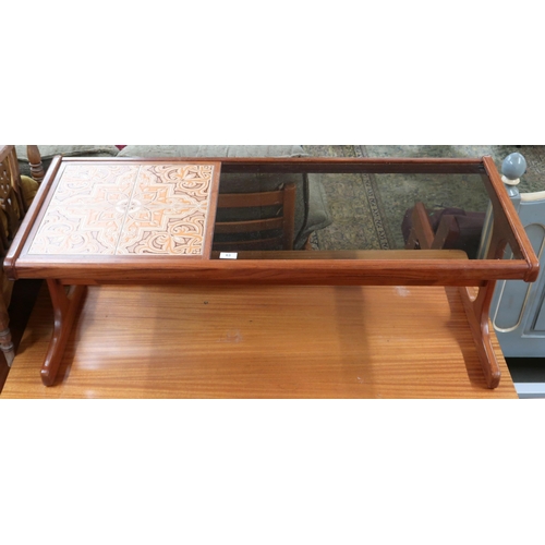 63 - A mid 20th century teak and glass coffee table with tile inset top on shaped supports joined by stre... 