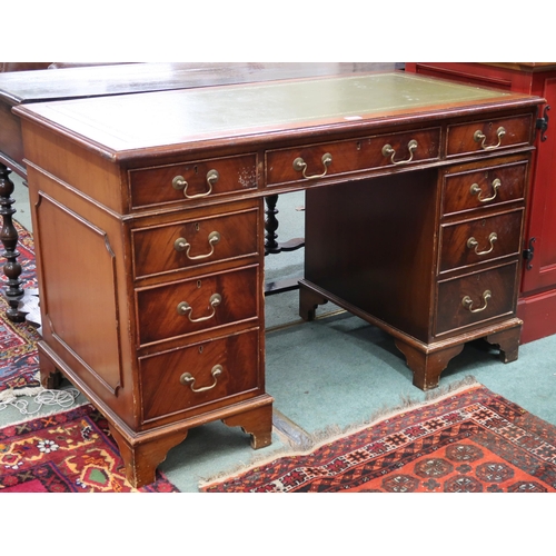 72 - An early 20th century pedestal writing desk with green embossed skiver over single central drawer fl... 