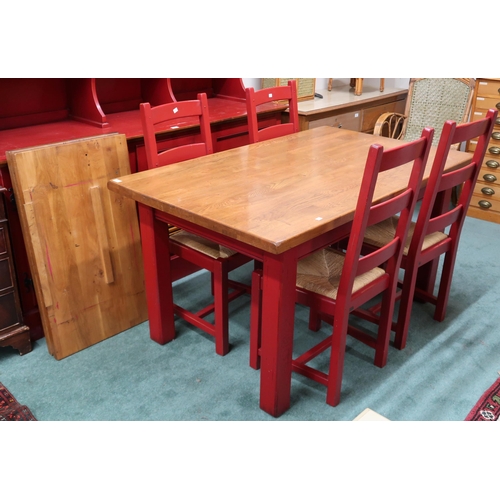 74 - A 20th century red painted Grange extending dining suite consisting extending table with elm top and... 