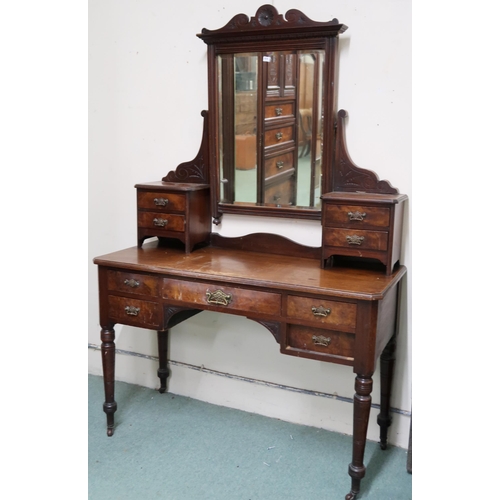 102 - A Victorian mahogany and walnut veneered bedroom suite consisting compactum wardrobe with pair of ca... 