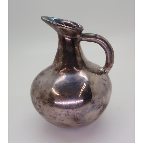 321A - A silver jug, modelled after a Cycladic pottery example, 11.5cm high, 115gms