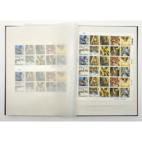 392 - GREAT BRITAIN a stock book containing decimal commemorative blocks of six together with strips of fo... 