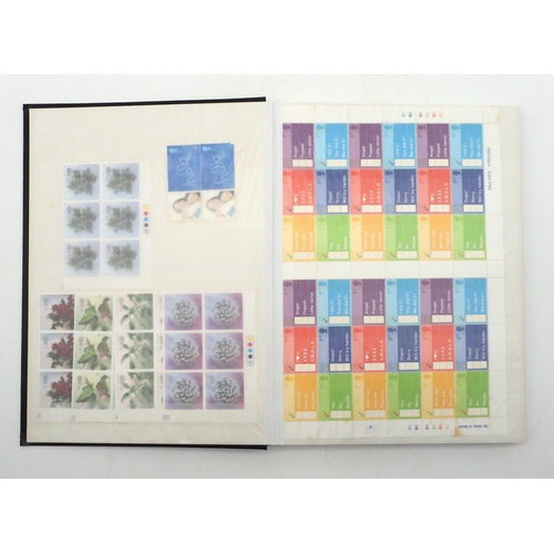 392 - GREAT BRITAIN a stock book containing decimal commemorative blocks of six together with strips of fo... 