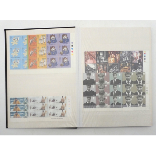 392 - GREAT BRITAIN a stock book containing decimal commemorative blocks of six together with strips of fo... 