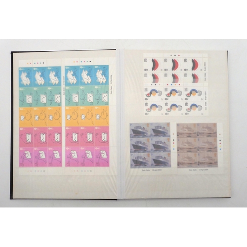 392 - GREAT BRITAIN a stock book containing decimal commemorative blocks of six together with strips of fo... 