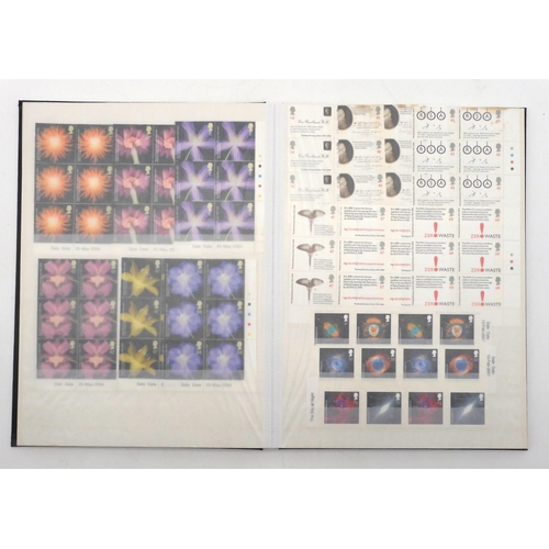 392 - GREAT BRITAIN a stock book containing decimal commemorative blocks of six together with strips of fo... 