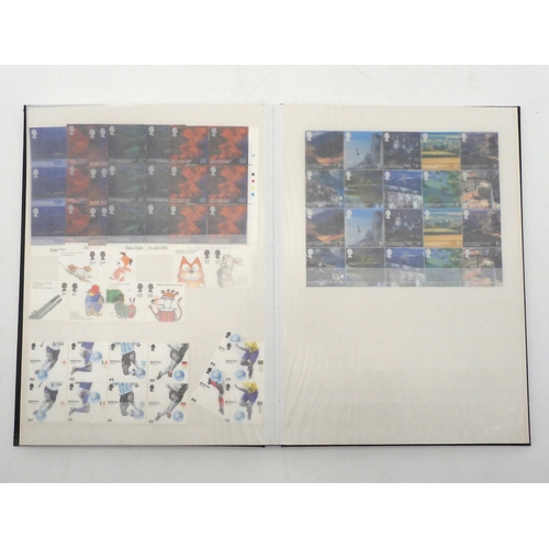 392 - GREAT BRITAIN a stock book containing decimal commemorative blocks of six together with strips of fo... 